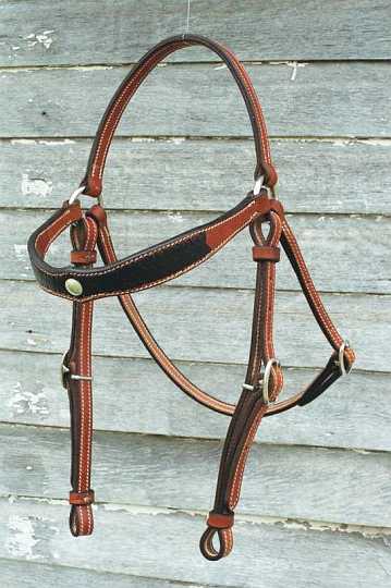 Stock bridle-1.jpg - Stock Bridle with Diamond Brow & Diamond Applique'
Bridle in Saddle Tan with Black roo hide Applique' - Silver concho centre piece.
Dressed with Stainless rings & swedge buckles
Leather Keepers.